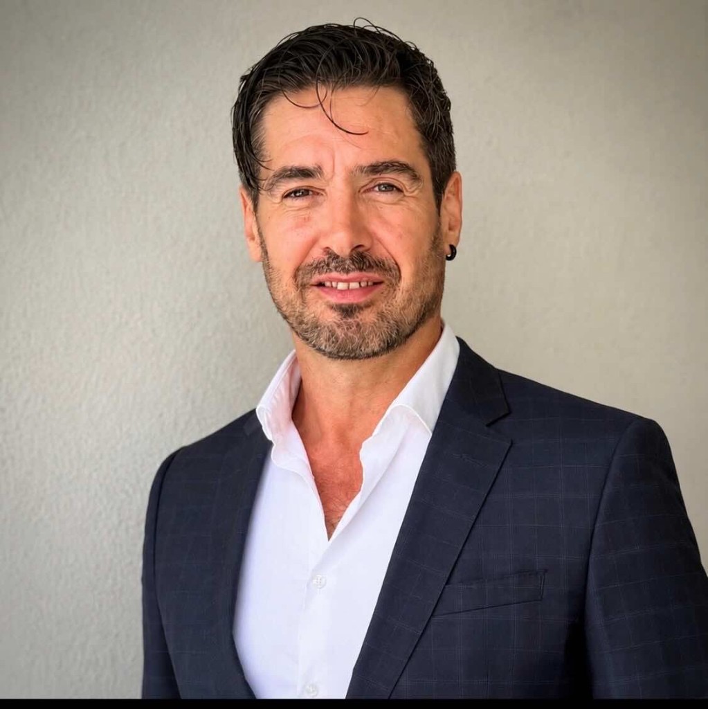 Portrait of Michel Bordeau in a navy blazer